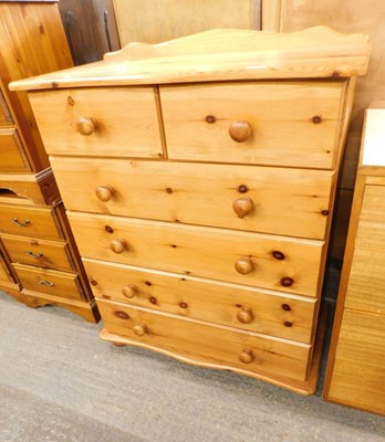 Lot 1527 - A pine chest of drawers, with overhanging...