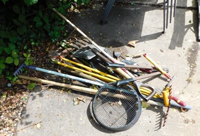 Lot 1592 - A collection of garden tools, to include rakes,...
