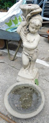 Lot 1599 - A reconstituted bird bath, with a column in...