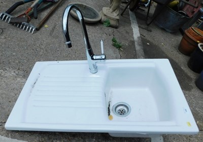 Lot 1601 - A ceramic white glazed single sink and...