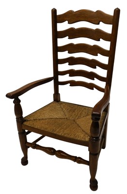 Lot 853 - An ash and elm ladder back armchair, with...