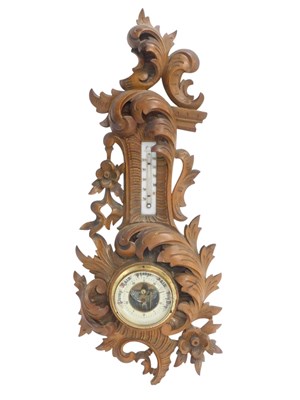 Lot 605 - A late 19th/early 20thC aneroid barometer...