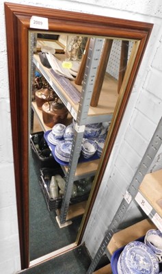 Lot 2089 - A rectangular wall mirror, with wooden frame,...