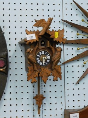 Lot 2159 - A modern wall hanging cuckoo clock, with...