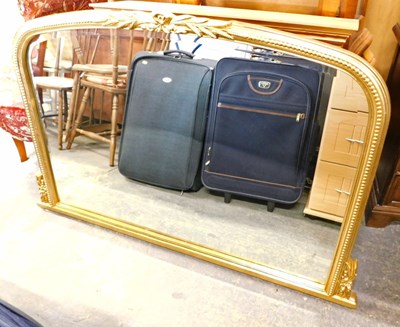 Lot 1529a - An early 20thC curved top gilded overmantel...