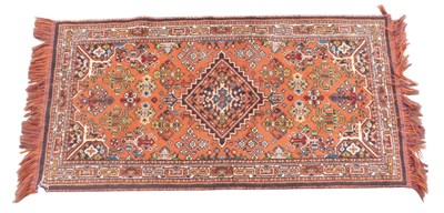 Lot 762 - A machine woven Oriental rug, with a design of...