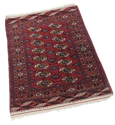 Lot 766 - An Afghan type rug, with two rows of...