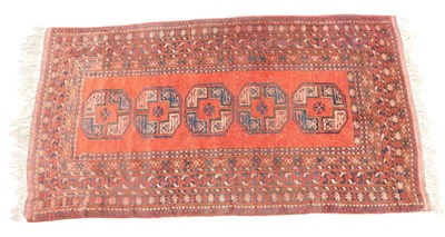 Lot 770 - A Turkoman rug, with a design of medallions,...