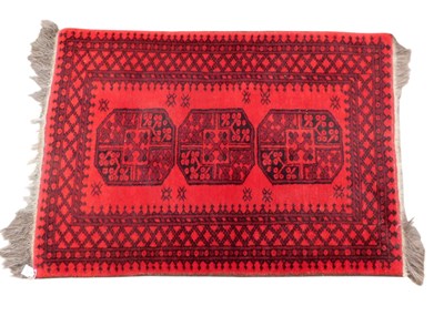 Lot 772 - A Turkoman type rug, with a design of three...