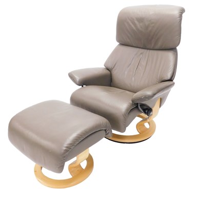 Lot 730 - A Stressless brown leather armchair, and stool.