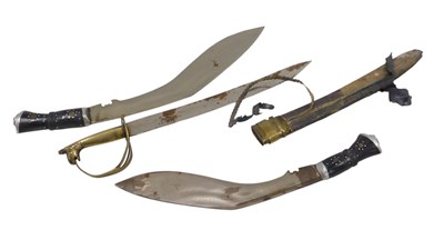 Lot 520 - Two kukri knives and a short bladed sabre,...