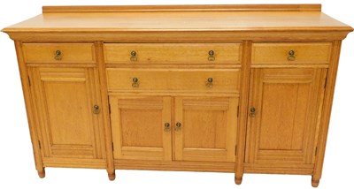 Lot 738 - A light oak sideboard, the top with a raised...