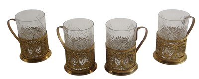 Lot 891 - A set of four cut glass and gilt filigree cups,...