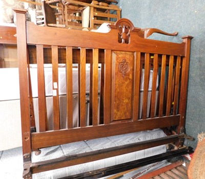 Lot 1701 - A late 19thC walnut bedhead and foot, 140cm...