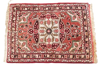 Lot 761 - A small Turkish rug, with a central medallion...