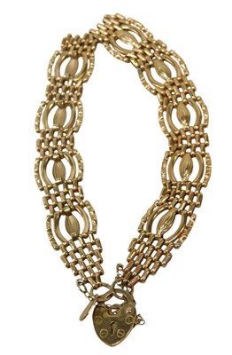 Lot 181 - A 9ct gold gate bracelet, of ballooned link,...
