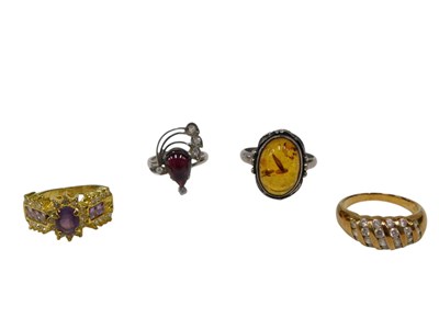Lot 179 - Four dress rings, comprising two gilt examples,...