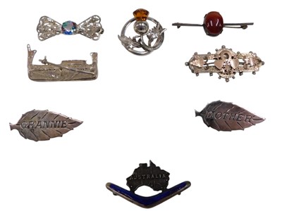 Lot 448 - A group of silver and white metal brooches,...