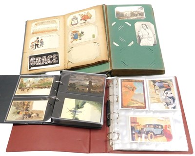 Lot 213 - Four postcard albums containing early 20thC...