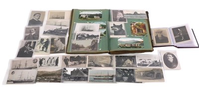 Lot 204 - An album of postcards, including cards...