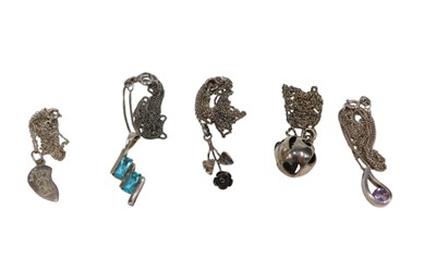 Lot 168 - Five silver pendants and chains, comprising a...