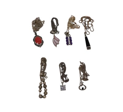 Lot 169 - A group of silver and other pendants and...
