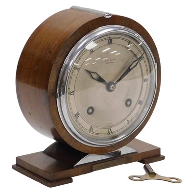 Lot 21 - An Empire Art Deco walnut cased mantel clock,...