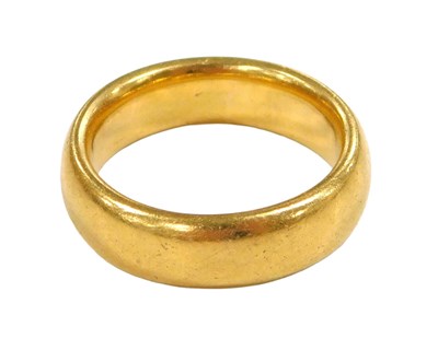 Lot 201 - A 22ct gold wedding band, size K, 10.2g.