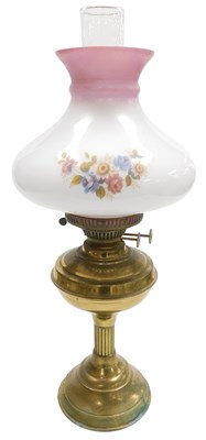 Lot 220 - A late 20thC brass oil lamp, with a glass...