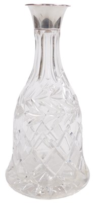 Lot 224 - A cut glass decanter, stopped lacking, of bell...