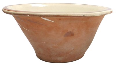 Lot 251 - A late 19thC terracotta and cream glazed dairy...