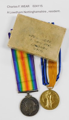 Lot 272 - A pair of World War I medals, named to Dvr CF...
