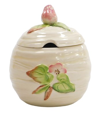 Lot 294 - A Clarice Cliff pottery preserve pot and cover,...