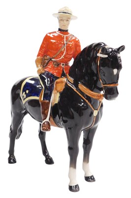 Lot 299 - A Beswick pottery figure of a Canadian Mountie,...