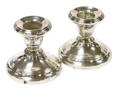 Lot 404 - A pair of George V loaded silver...
