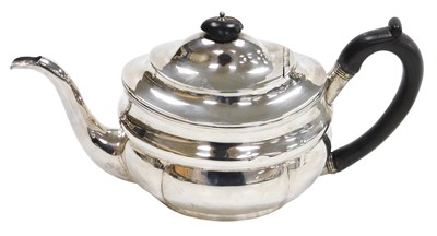 Lot 19 - A George III silver teapot, of bombe form,...
