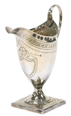 Lot 418 - A George III silver helmet-shaped cream jug,...
