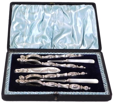 Lot 484 - A composite nut set, silver plate, stainless...