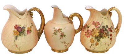 Lot 494 - Three Royal Worcester blush porcelain jugs,...