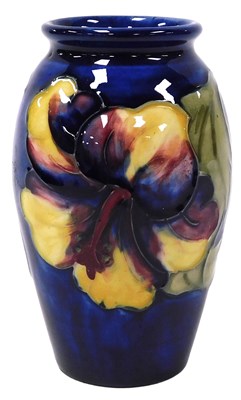Lot 476 - A Moorcroft pottery Hibiscus pattern vase, of...