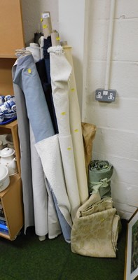 Lot 2026 - Various bolts of fabric, in blue, cream, grey,...