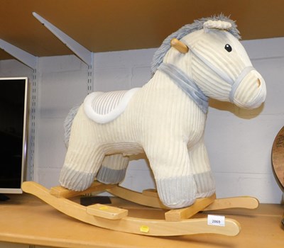 Lot 2069 - A plush rocking horse, on a beech base, 58cm...