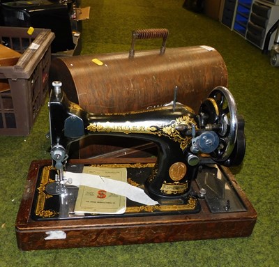 Lot 2126 - A Singer hand operated cased sewing machine.
