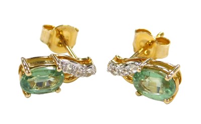 Lot 553 - A pair of emerald and diamond drop earrings,...