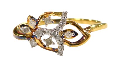 Lot 559 - A diamond ring, in a stylised floral and leaf...