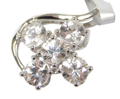 Lot 565 - A 10ct white gold and zircon pendant cross, in...