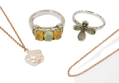 Lot 566 - A silver and diamond set flower head ring,...