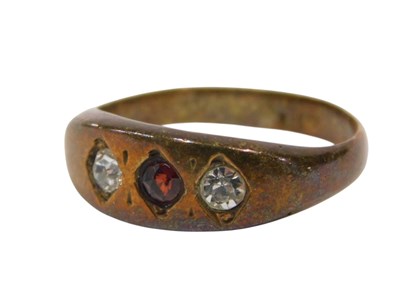 Lot 429 - A three stone dress ring, set with two white...
