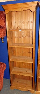 Lot 1004 - A pine narrow bookcase, the top with a moulded...