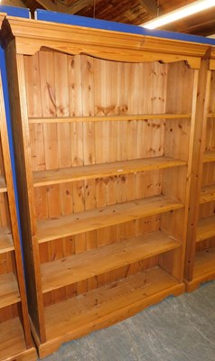 Lot 1005 - A pine open bookcase, the top with a moulded...